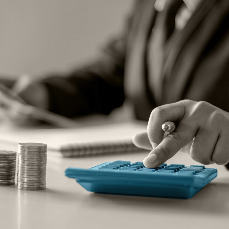 hands on calculator that is teal colored