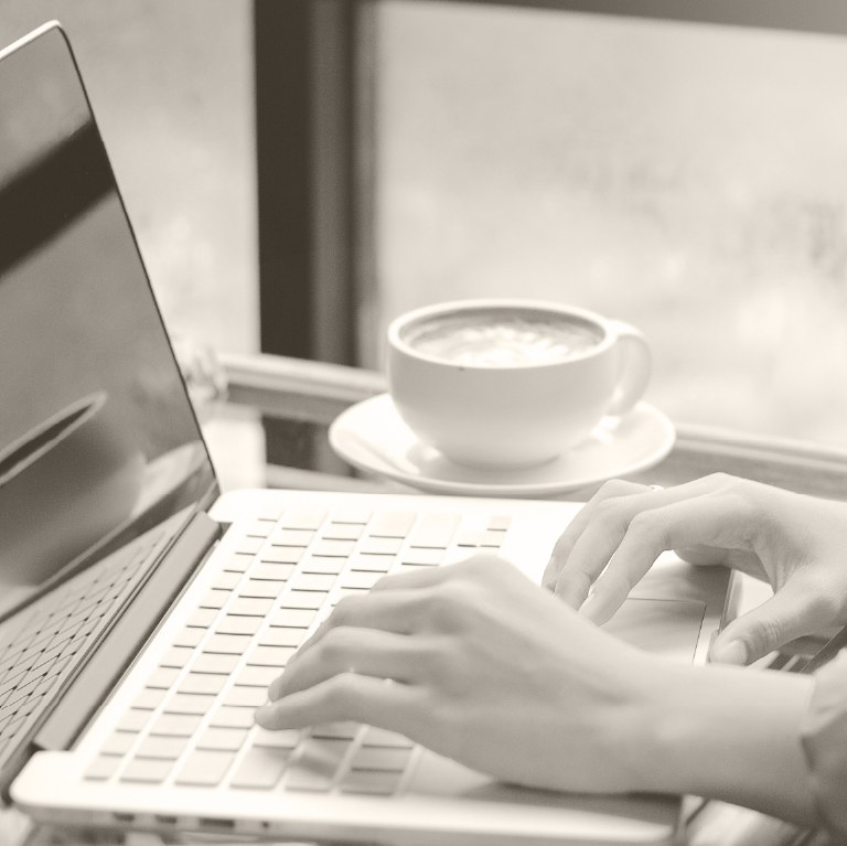 hands on a laptop