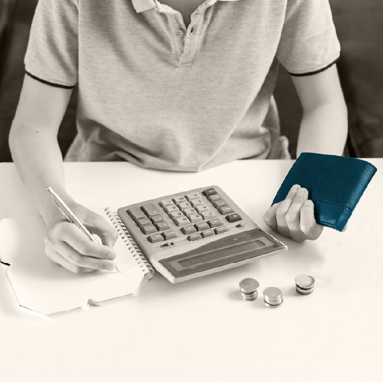 teen at desk with tablet and laptop