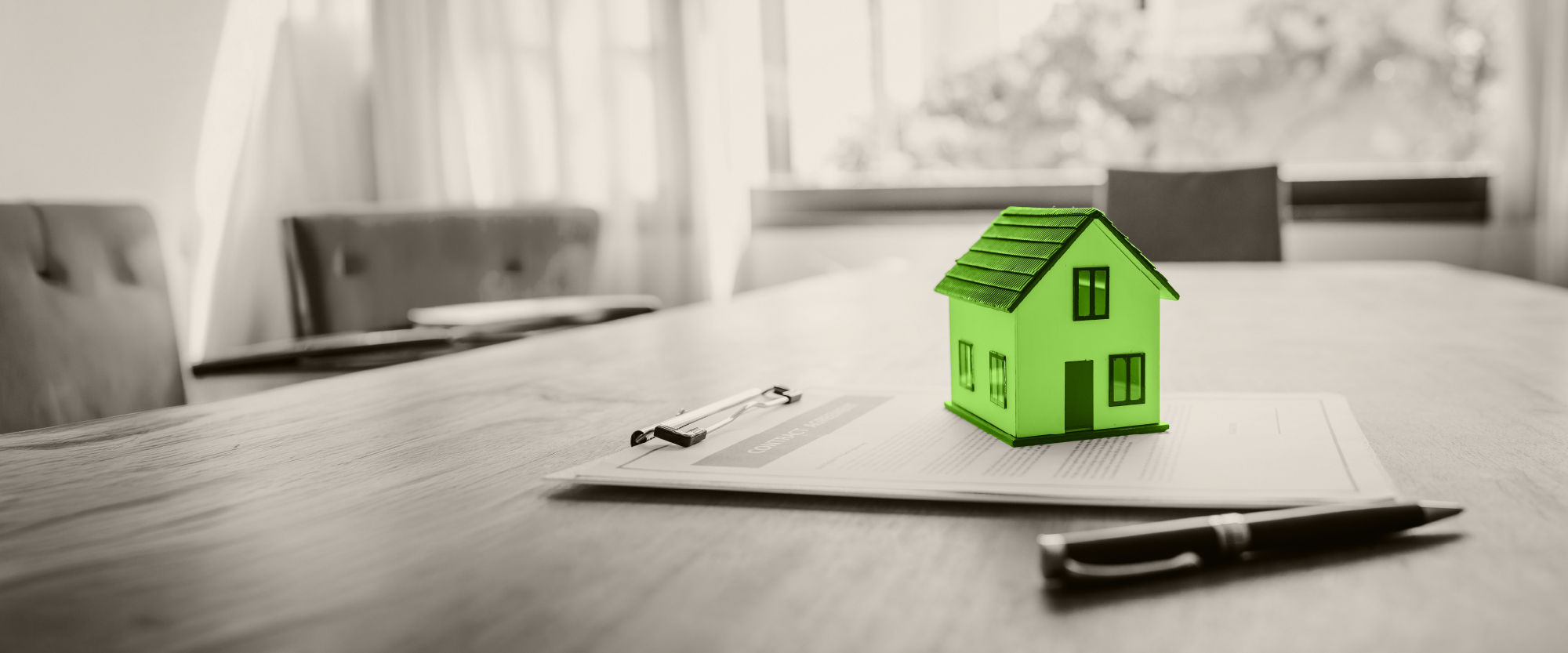 green house on an application on a clipboard with a pen next to it