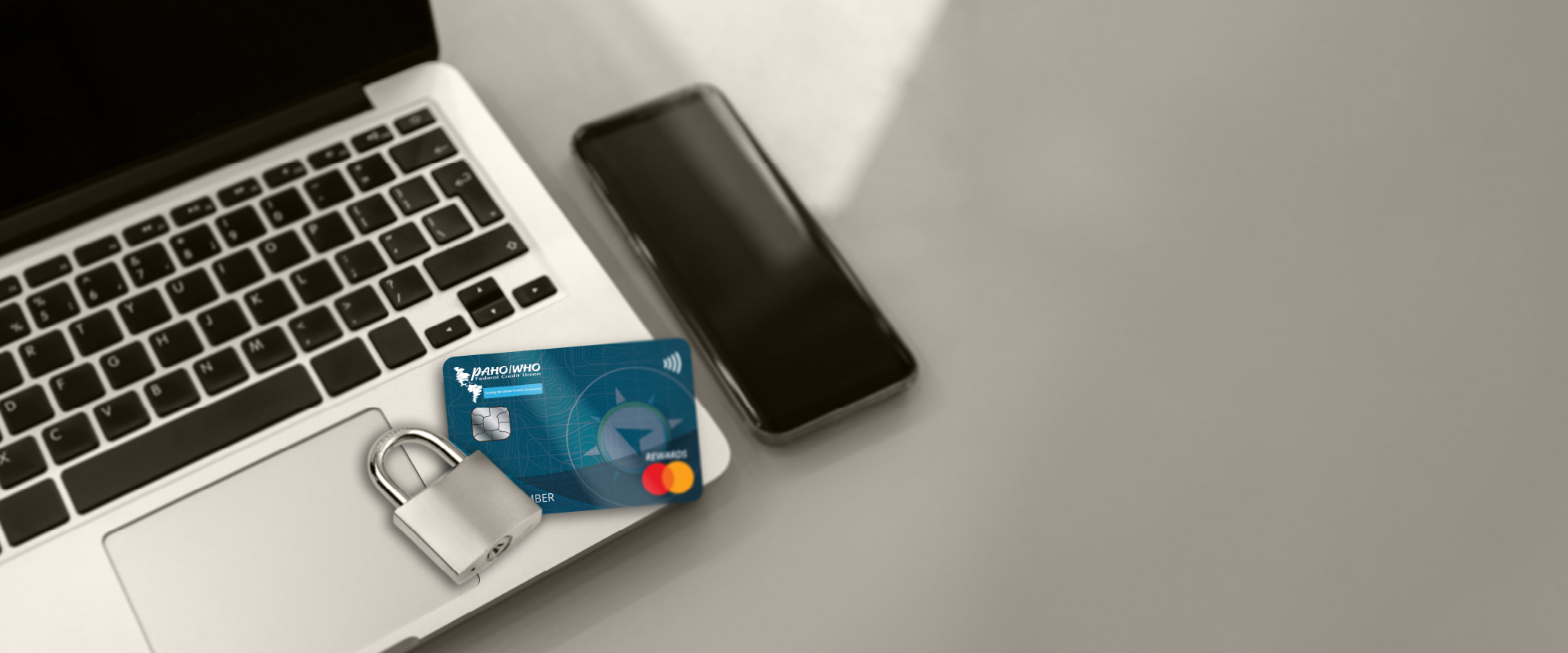 credit card on top of a laptop