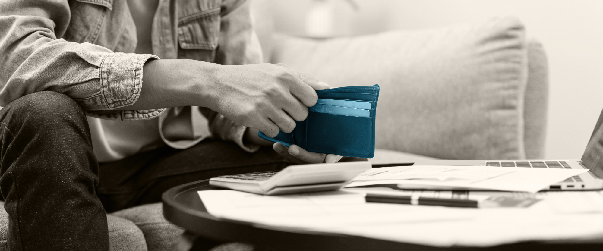 card in blue on a desk with laptop open